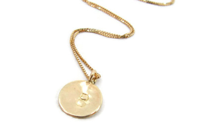 Crafting Your Story: The Magic Behind an 18k Gold Initial Necklace